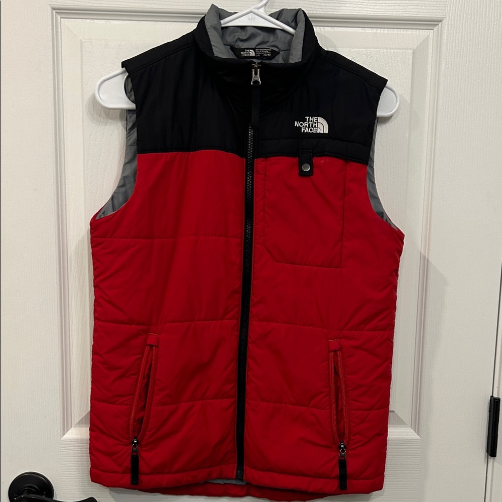 The North Face boys lightweight vest. large 14/16. Red and black. Used cond